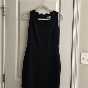 Black sleeveless dress with scallop neckline